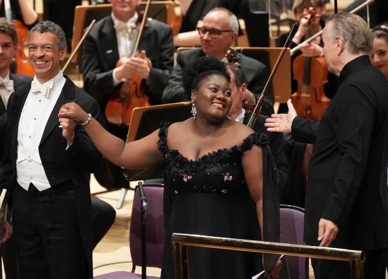 Soprano Masabane Cecilia Rangwanasha and Roderick Williams acknowledge applause with Sir Mark Elder. Picture by Tom Stephens