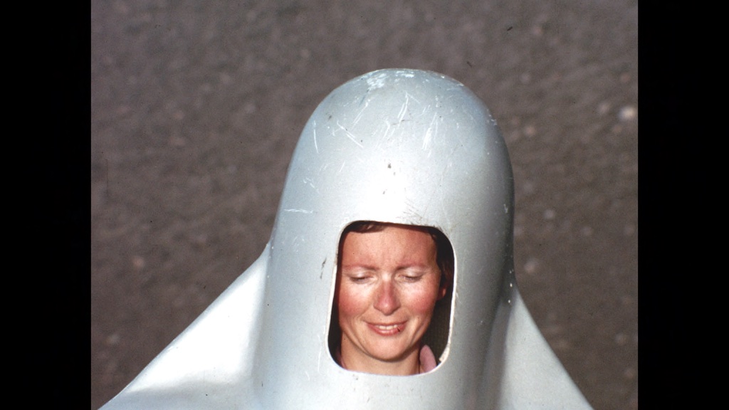 Katia smiles while putting on her giant metal helmet while on Mt Etna in 1972. (Credit: Image'Est)