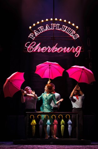 Joanna_Riding_Mdme_Emery_and_Sailors_The_Umbrellas_Of_Cherbourg_by_Steve_Tanner