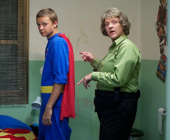 Chris Lilley as Gran with one of her juvenile charges in superhero pyjamas