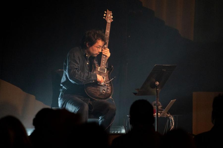 Sean Shibe on electric guitar in the QEH foyer